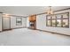 Bright living room with a brick fireplace and large window at 521 Eagle Crest Dr, Brownsburg, IN 46112