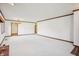 Spacious living room with plush carpeting and a brick fireplace at 521 Eagle Crest Dr, Brownsburg, IN 46112
