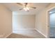 Spacious bedroom with ceiling fan and carpet at 320 S Howard St, Summitville, IN 46070