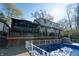 Large deck, inground pool, screened porch, and wooded backdrop at 6605 Donnelly Dr, Brownsburg, IN 46112