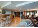 Finished basement with a wet bar, comfortable seating, and display cabinets at 6605 Donnelly Dr, Brownsburg, IN 46112