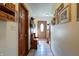 Spacious hallway with wood flooring and a view of the front door at 6605 Donnelly Dr, Brownsburg, IN 46112