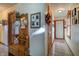 Bright hallway featuring hardwood floor and antique bench at 6605 Donnelly Dr, Brownsburg, IN 46112