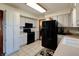 Modern kitchen with black appliances and ample cabinetry at 6605 Donnelly Dr, Brownsburg, IN 46112