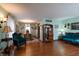 Bright living room with hardwood floors, antique furniture, and a view of the dining area at 6605 Donnelly Dr, Brownsburg, IN 46112
