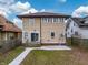 House exterior showcasing a spacious backyard and patio area at 626 N Dequincy St, Indianapolis, IN 46201