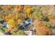 Aerial view showcasing a house nestled amongst vibrant autumn foliage at 6902 Creekridge Trl, Indianapolis, IN 46256