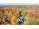 Aerial view of a house surrounded by colorful fall trees at 6902 Creekridge Trl, Indianapolis, IN 46256