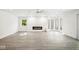 Finished basement with hardwood floors, fireplace, and large windows at 6902 Creekridge Trl, Indianapolis, IN 46256
