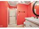 Basement bathroom with coral walls and shower at 6902 Creekridge Trl, Indianapolis, IN 46256