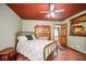 Charming bedroom with brass bed frame and terracotta tile floor at 6902 Creekridge Trl, Indianapolis, IN 46256
