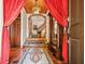 Elegant entryway with tile floor, arched entry, and stained glass light at 6902 Creekridge Trl, Indianapolis, IN 46256