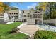 Stunning home exterior with a large backyard, deck, and inground pool at 6902 Creekridge Trl, Indianapolis, IN 46256