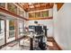 Bright home office with built-in bookshelves and access to a private balcony at 6902 Creekridge Trl, Indianapolis, IN 46256
