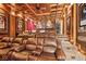 Luxurious home theater with tiered seating and a large projection screen at 6902 Creekridge Trl, Indianapolis, IN 46256