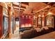 Luxurious home theater with comfortable seating and a large screen at 6902 Creekridge Trl, Indianapolis, IN 46256