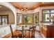 Kitchen breakfast nook with bay window and view of trees at 6902 Creekridge Trl, Indianapolis, IN 46256