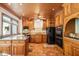 Spacious kitchen with wood cabinets, granite counters, and island at 6902 Creekridge Trl, Indianapolis, IN 46256