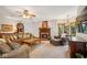 Cozy living room with fireplace, large windows and ample seating at 6902 Creekridge Trl, Indianapolis, IN 46256