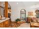 Spacious living room with hardwood floors and sunroom access at 6902 Creekridge Trl, Indianapolis, IN 46256