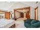 Main bedroom suite with sitting area and access to a large bathroom at 6902 Creekridge Trl, Indianapolis, IN 46256