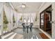 Screened porch with outdoor seating, providing a relaxing space to enjoy the outdoors at 6902 Creekridge Trl, Indianapolis, IN 46256