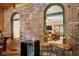 Two bar stools facing a view into another room at 6902 Creekridge Trl, Indianapolis, IN 46256