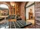 Dark green tile wet bar with brick and wood features at 6902 Creekridge Trl, Indianapolis, IN 46256