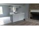 Kitchen with gray cabinets, white countertops, and a breakfast bar at 2021 N Graham Ave, Indianapolis, IN 46218