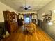 Dining room featuring hardwood floors, a large wooden table, and a built-in hutch at 8353 N Sr 109, Wilkinson, IN 46186