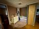 Bathroom with a tub and tiled walls at 8353 N Sr 109, Wilkinson, IN 46186