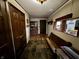 Inviting entryway with a built-in bench and view of the kitchen at 8353 N Sr 109, Wilkinson, IN 46186