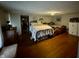 Upstairs bedroom with two beds and hardwood floors at 8353 N Sr 109, Wilkinson, IN 46186