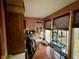 Sunroom with terracotta tile floor, birdcage, and large windows at 8353 N Sr 109, Wilkinson, IN 46186