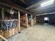View of barn stalls with tack hanging on the wall at 8353 N Sr 109, Wilkinson, IN 46186