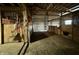 Barn with multiple empty stalls and farm tools at 8353 N Sr 109, Wilkinson, IN 46186