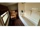 Small bathroom with tub and window at 8353 N Sr 109, Wilkinson, IN 46186