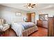 Bedroom with hardwood floors, ceiling fan, and ensuite access at 3784 Mansfield Dr, Brownsburg, IN 46112