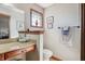 Bathroom with granite vanity and decorative mirror at 3784 Mansfield Dr, Brownsburg, IN 46112