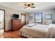 Bright bedroom with hardwood floors and ceiling fan at 3784 Mansfield Dr, Brownsburg, IN 46112
