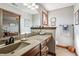Bathroom with double vanity and large mirror at 3784 Mansfield Dr, Brownsburg, IN 46112