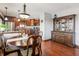 Spacious dining room featuring hardwood floors and a charming wooden table at 3784 Mansfield Dr, Brownsburg, IN 46112