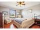 Bedroom with hardwood floors, ceiling fan, and comfy seating at 3784 Mansfield Dr, Brownsburg, IN 46112