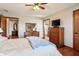 Spacious bedroom with hardwood floors and ensuite bathroom at 3784 Mansfield Dr, Brownsburg, IN 46112