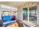 Sunroom with blue couches and a wooden coffee table at 3784 Mansfield Dr, Brownsburg, IN 46112