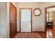Bright entryway with hardwood floors and stained wood doors at 3784 Mansfield Dr, Brownsburg, IN 46112
