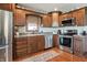 Modern kitchen boasting stainless steel appliances and wood cabinets at 3784 Mansfield Dr, Brownsburg, IN 46112