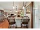 Kitchen breakfast bar with wooden stools, offering a casual dining space at 3784 Mansfield Dr, Brownsburg, IN 46112