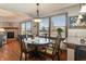 Bright dining room with hardwood floors and a charming table set for four at 3784 Mansfield Dr, Brownsburg, IN 46112