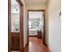 Hallway with wood floors, showing a bathroom and bedroom at 3784 Mansfield Dr, Brownsburg, IN 46112